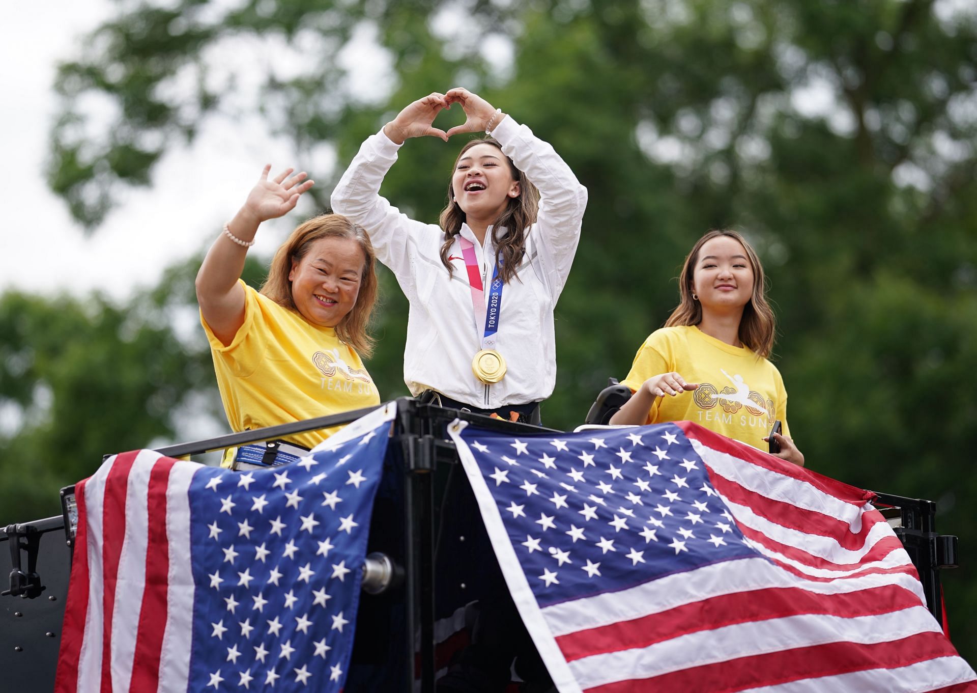 Suni Lee with her mother and sister at the Sunisa Lee Parade - Source: Getty